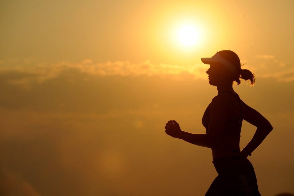 runner with sun in the distance