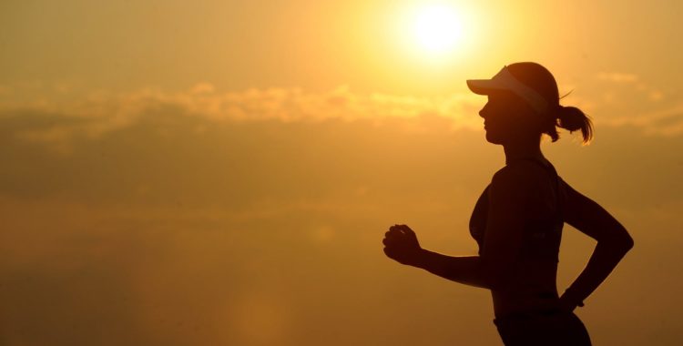 runner with sun in the distance