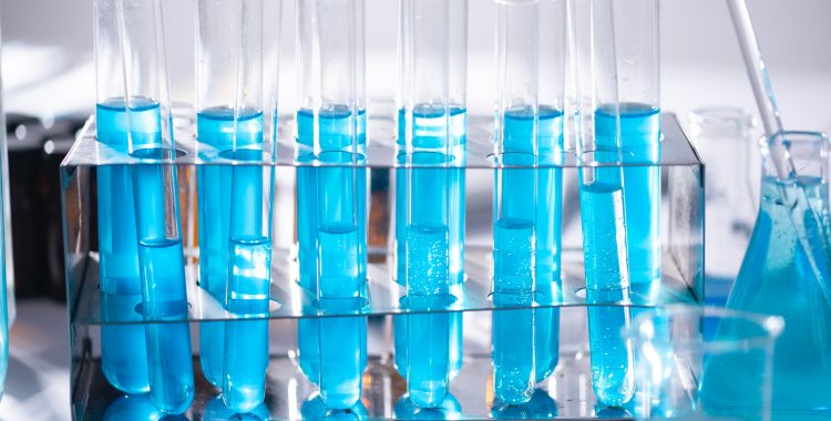 test vials filled with blue liquid