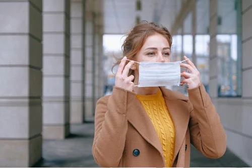 a woman in a face mask