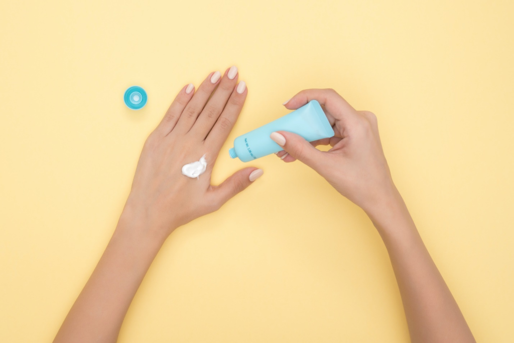 a person applying sunscreen