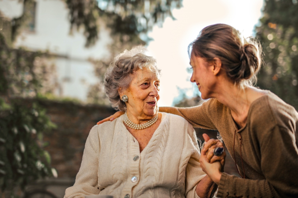 an elderly with their caretaker