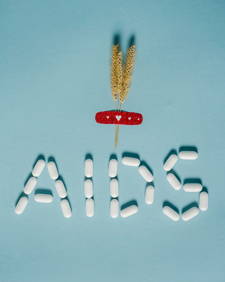 Pills arranged to spell 'AIDS' placed on a table