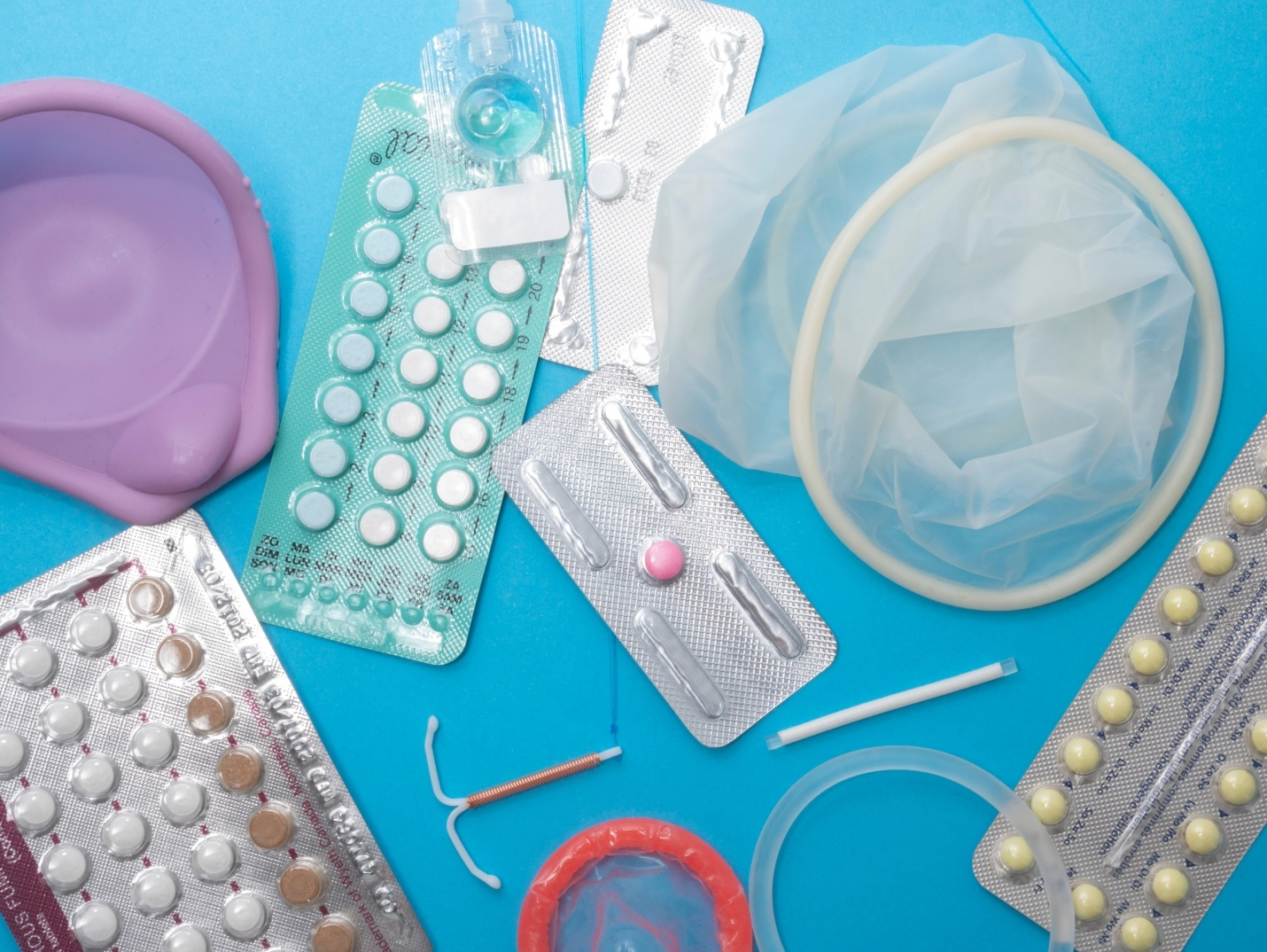 Reproductive health supplies placed on a table among prescription drugs