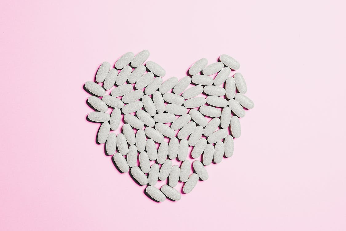 An image of pills arranged in a heart shape