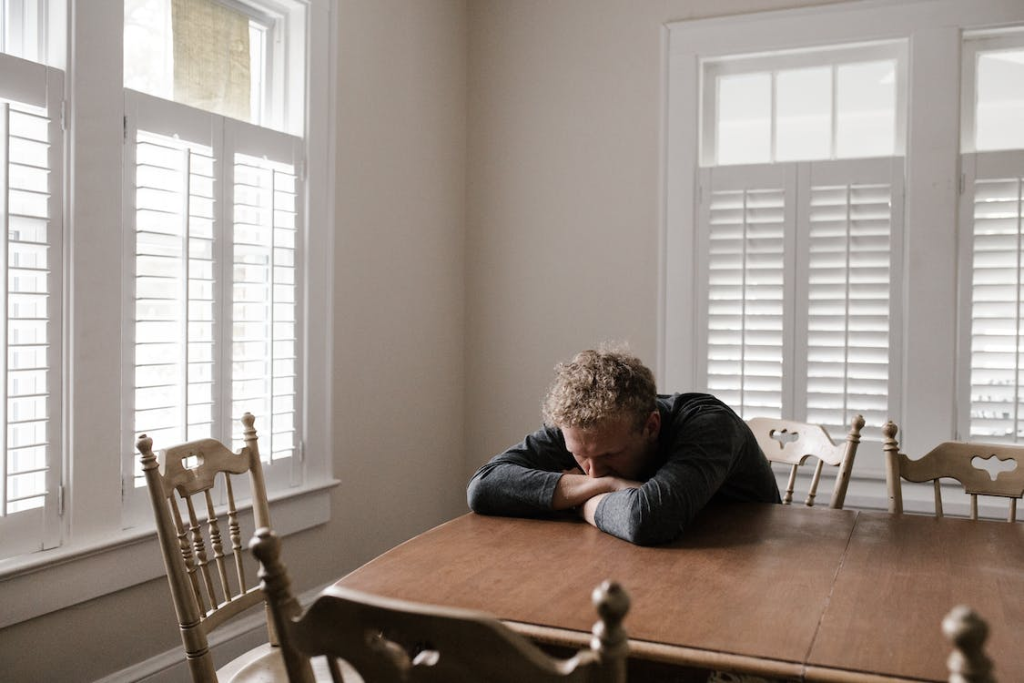 An image of a man sitting on a chair
