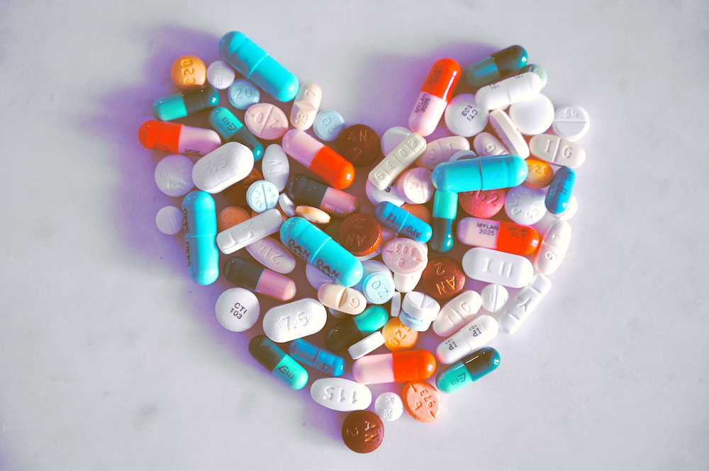 pills arranged to form a love heart