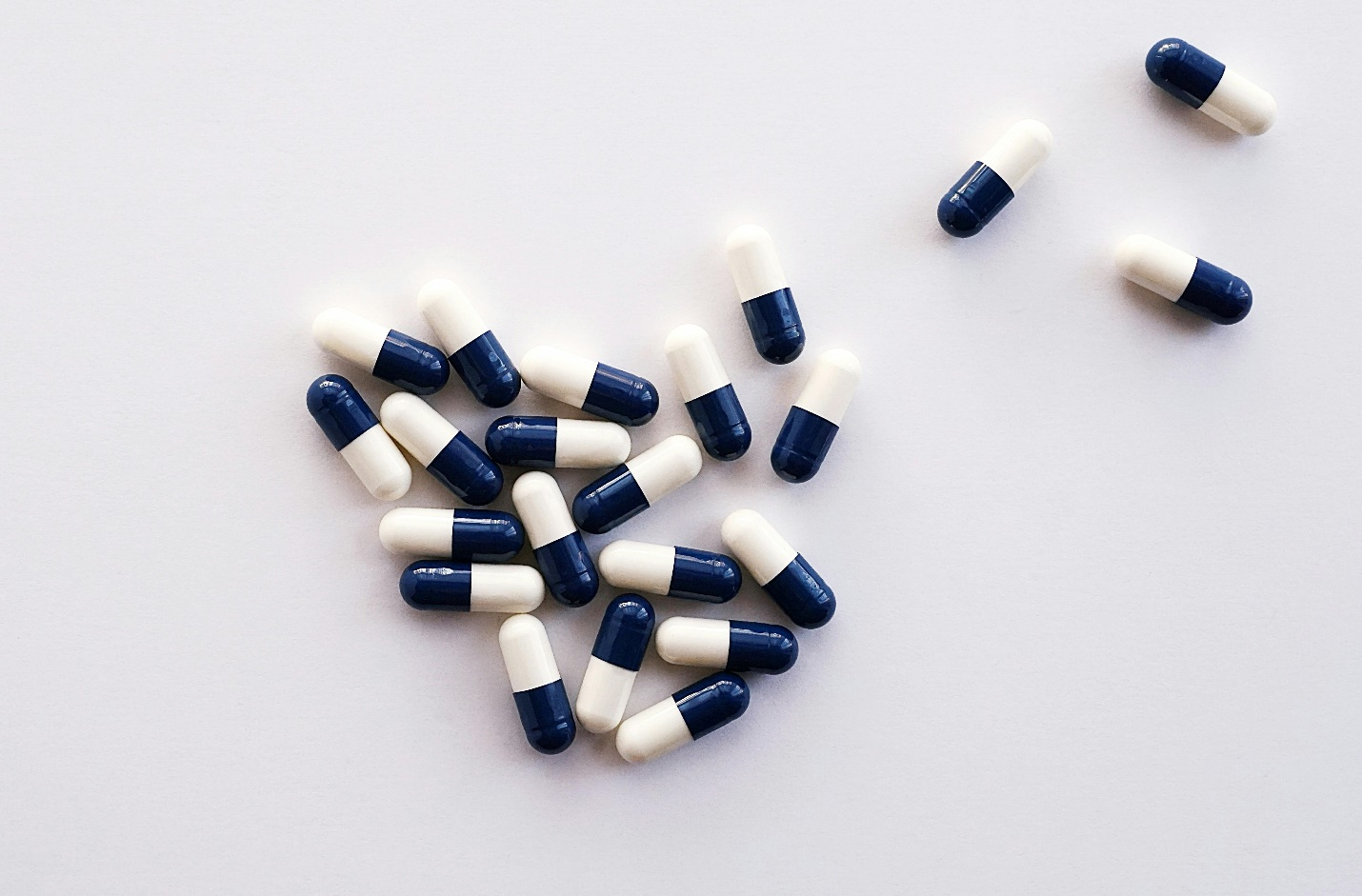 half blue and half white capsules