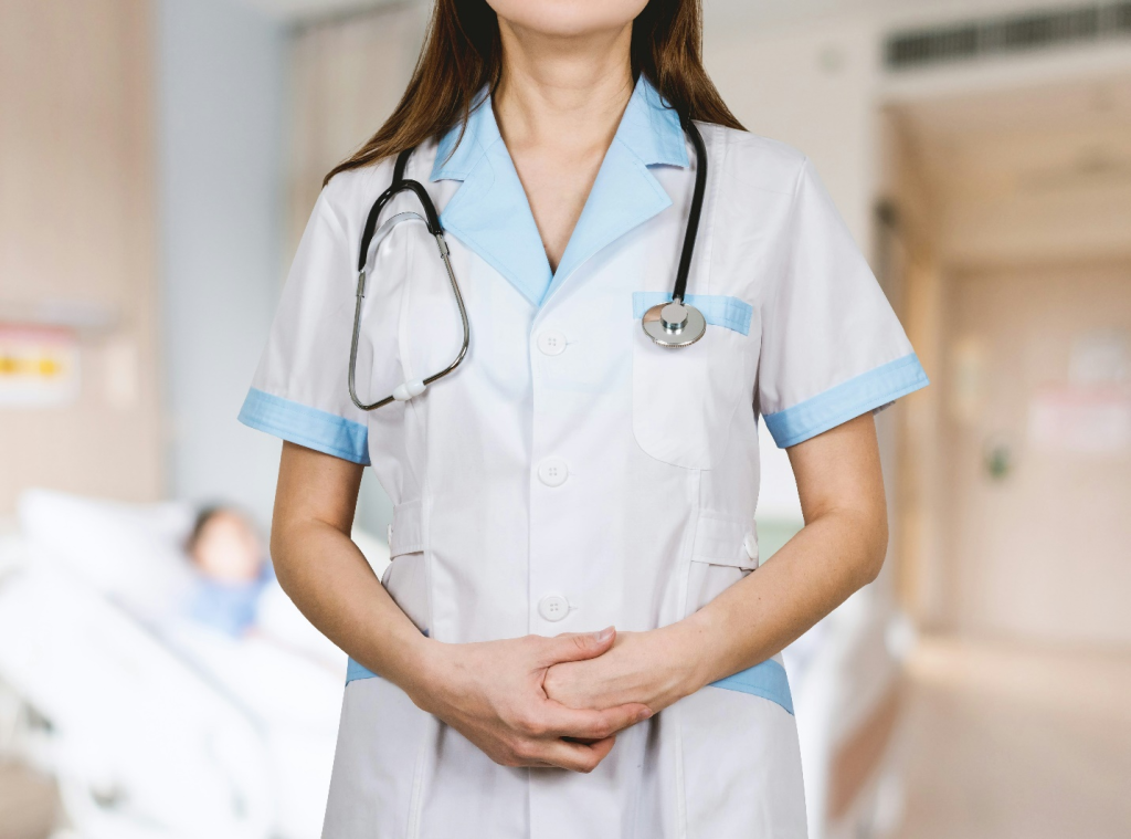 a woman in a nurse dress and a stethoscope around her neck
