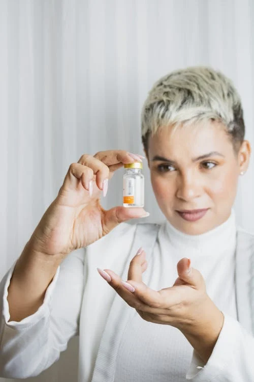 A healthcare professional holding specialized medication