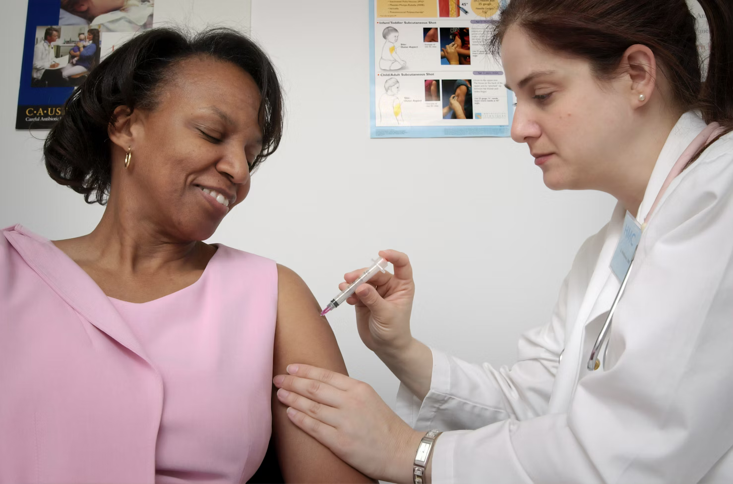 A smiling patient receiving assistance