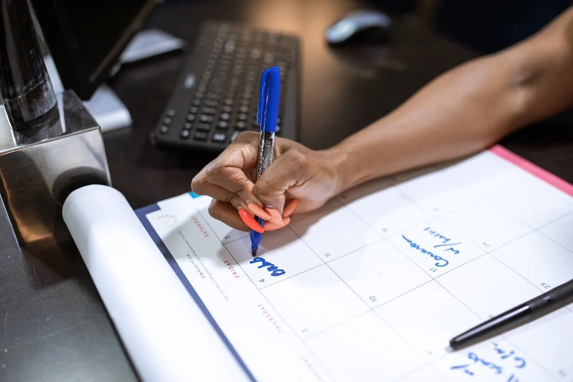 A calendar with reminders to track prescription assistance renewal dates