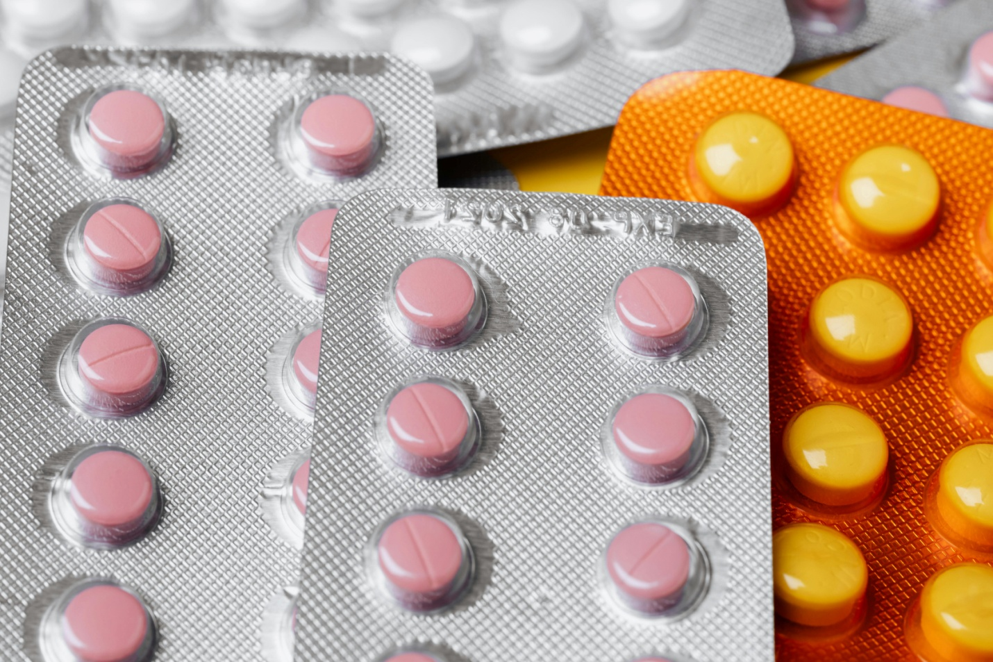 packs of medicines stacked on top of each other