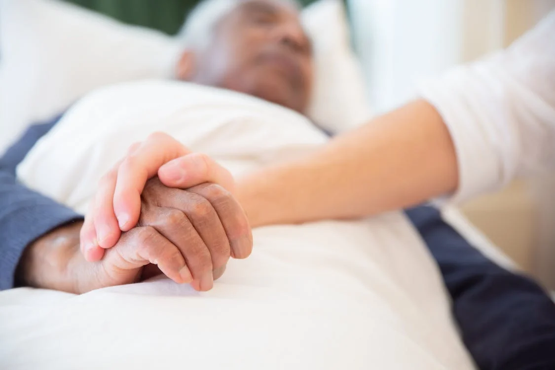 A person providing support to an elderly person