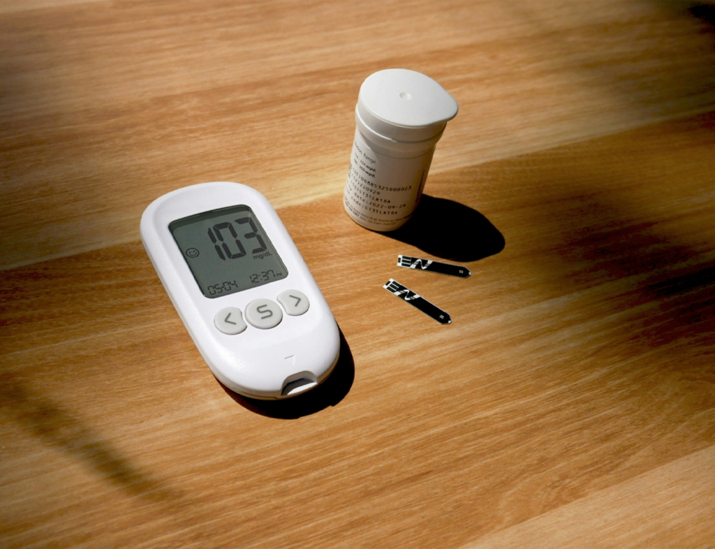 medical equipment for diabetes patients on a wooden surface