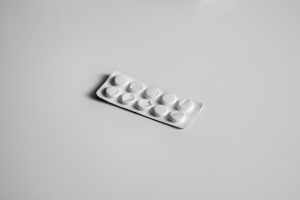 white blister pack of medicine on a white surface