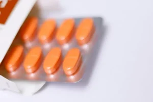 A blister pack of orange pills