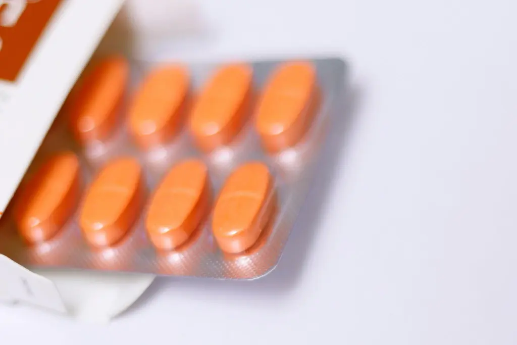 A blister pack of orange pills