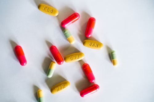Prescription pills scattered on a surface