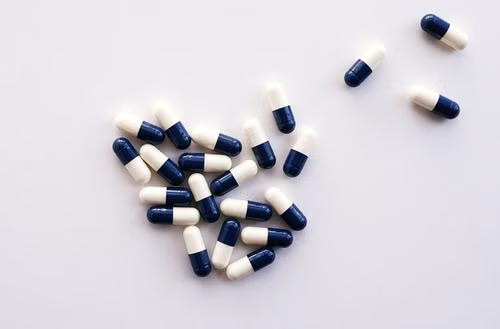 Prescription pills arranged on a table for medication assistance research