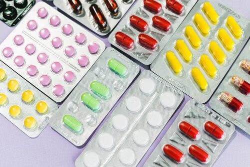 Assorted pharmaceutical pills arranged in blister packs