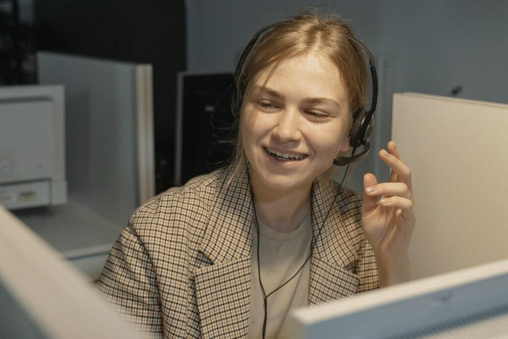 This photo shows a customer support representative wearing a headset.