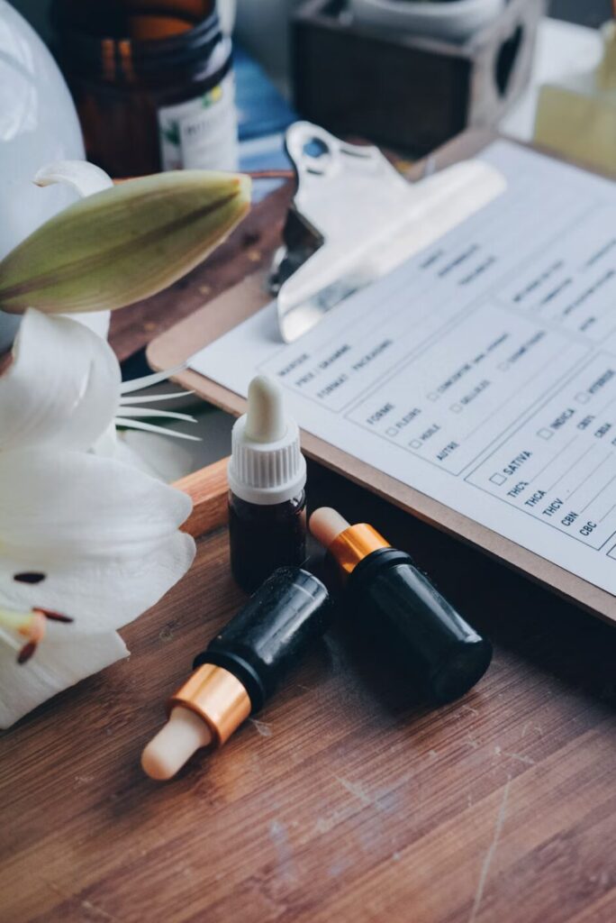 This photo shows a clipboard with documents and generic medications on a desk.