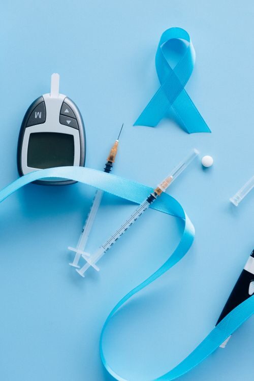 An image of a blood sugar monitor and syringes