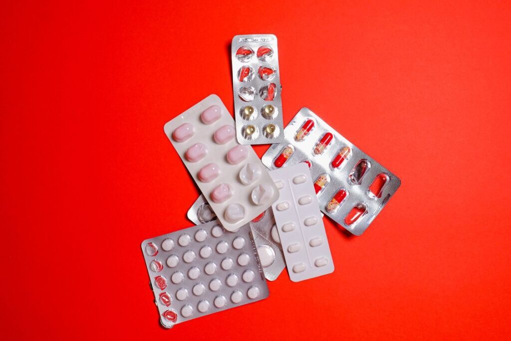 An image of medicines on a red background