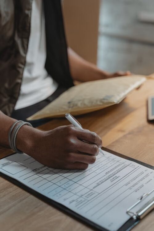 An image of a person filling out a form