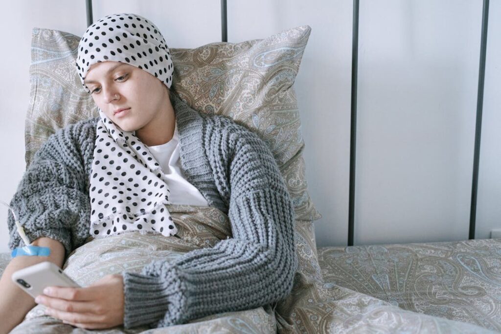 a cancer patient checking medication assistance on the phone